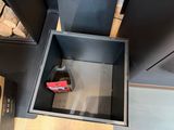 a metal box with a phone inside of it