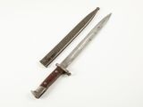 pair of two knives on a white surface with a white background