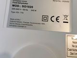 a close up of a computer mouse with a sticker on it