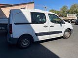a white van that is parked in a parking lot