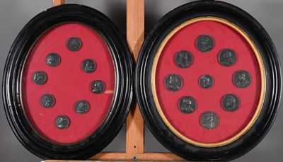 two framed pictures of a ladybug on a table