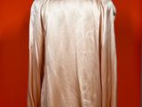 an image of a mannequin mannequin with a gold shirt on it