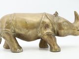 bronze statue of a rhinocero on a white background