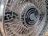 a metal fan that is sitting on top of a pallet