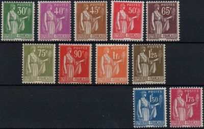 a close up of a group of different colored stamps on a black surface