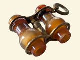 a close up of a pair of binoculars on a keychain