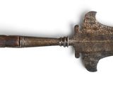 a very old and rusty looking knife on a white surface