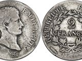 a close up of a coin on a white background