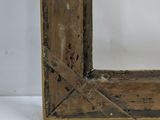 an old wooden picture frame sitting on top of a white table