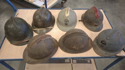 many helmets that are on a cart in the warehouse