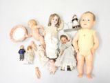 a lot of dolls that are sitting on a table