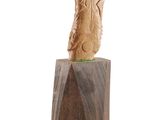 an image of a wooden sculpture of a bird on a wooden block