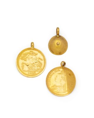 three gold coin pendants on a white background