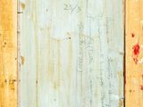 an image of a painting of a wooden frame with writing on it