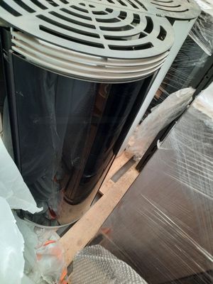 a large metal fan sitting on top of a pile of plastic