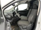 the interior of a white van with the driver ' s seat up