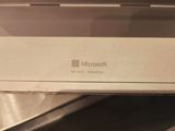 a white box with a microsoft logo sitting on top of it