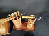 a wooden box with a knife and a wooden bucket with a bamboo handle