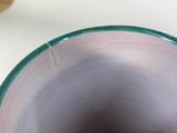 a close up of a bowl on a table
