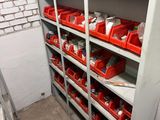 many red bins on the shelves in the room