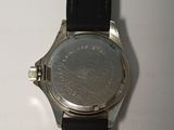 an image of a close up of a wrist watch on a table