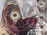 a box full of wires and threads in it