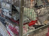 a large metal cage filled with lots of items