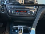 the interior of a car with a steering wheel and dashboard controls