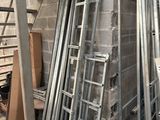 a pile of metal ladders stacked on top of each other