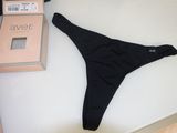 a black thong that is laying on a table