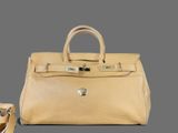 beige leather handbag and shoes on grey background with grey background