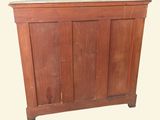 a wooden cabinet with a door on the top of it