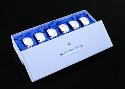 a box that has four silver watches in it