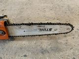 a chainsaw that is sitting on the ground