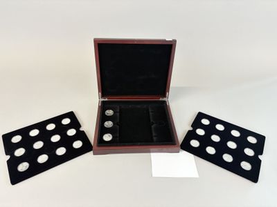 an image of a wooden box with four cuff rings in it