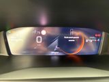 the dashboard of a car with a digital display on it