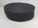 a set of four black sponge pads on a white surface