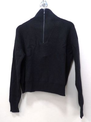 the sweater is black and has a zipper on the front