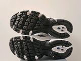 a close up of a pair of running shoes on a box