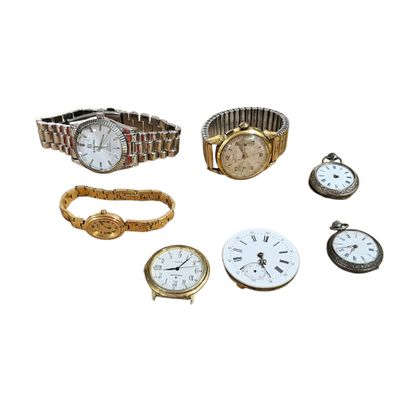 several different types of watches and bracelets on a white surface