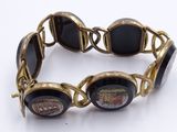gold tone bracelet with black onyx glass cabs and gold tone links
