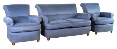 three blue couches and a chair sitting next to each other on a white background