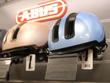 three helmets that are on display in a store
