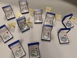 a lot of silver coins that are on the table