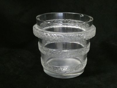 a clear glass vase with a decorative design on it