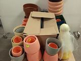 a pile of pots sitting on top of a cardboard box