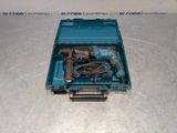 a blue box with a drill and a cord in it