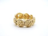a close up of a gold ring on a white background