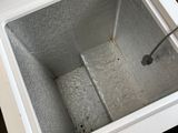 a white refrigerator sitting in the middle of a kitchen