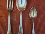 a spoon, fork and spoon on a table